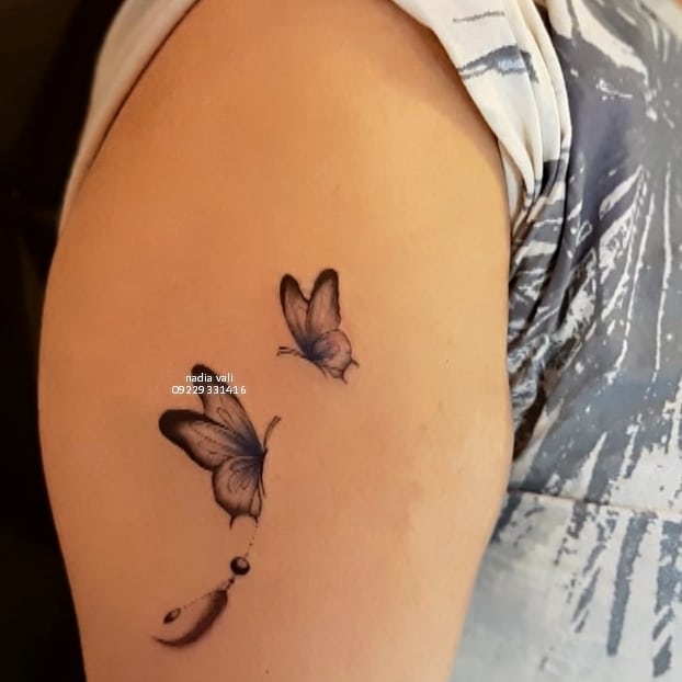 تاتو کاور لک اسکار بازو طرح پروانه